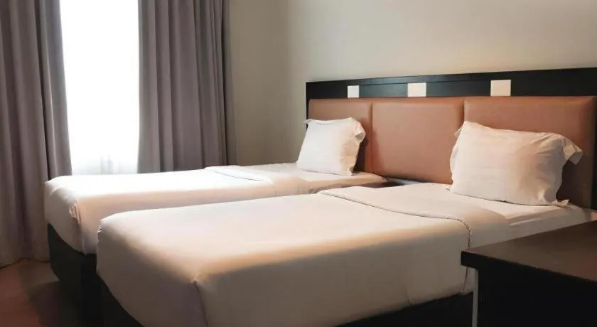 Bed in The BCC Hotel & Residence