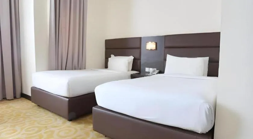 Bed in The BCC Hotel & Residence