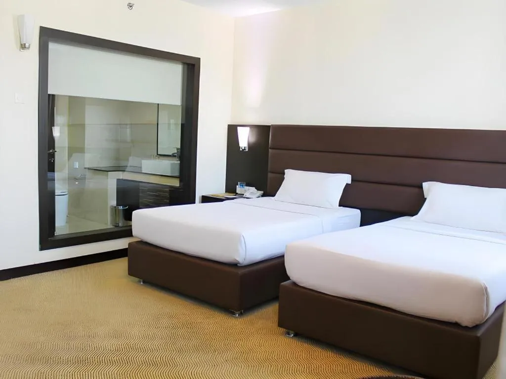 Bed in The BCC Hotel & Residence