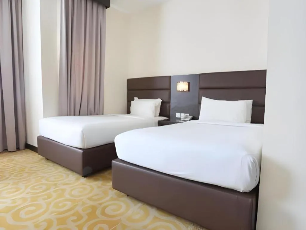 Bed in The BCC Hotel & Residence