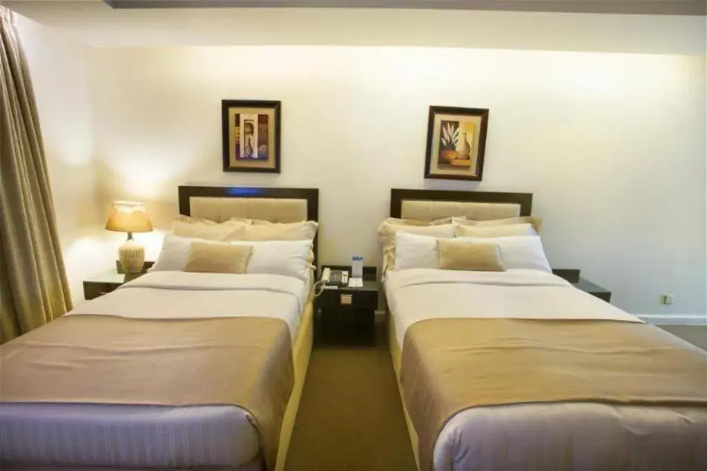 Bed in Hotel Agrabad Bed in Hotel Agrabad