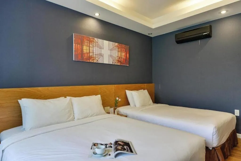 Bed in AHA Boutique Ben Thanh Hotel