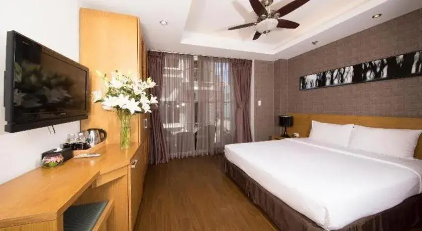 Bed in AHA Boutique Ben Thanh Hotel Bed in AHA Boutique Ben Thanh Hotel