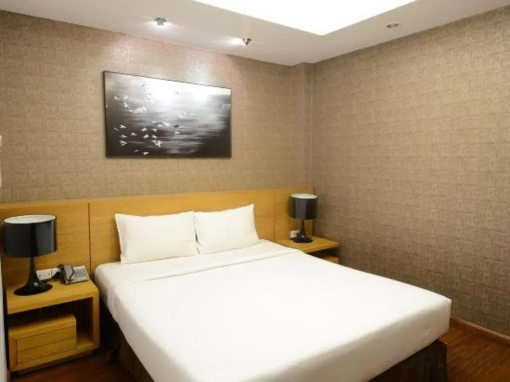 Bed in AHA Boutique Ben Thanh Hotel