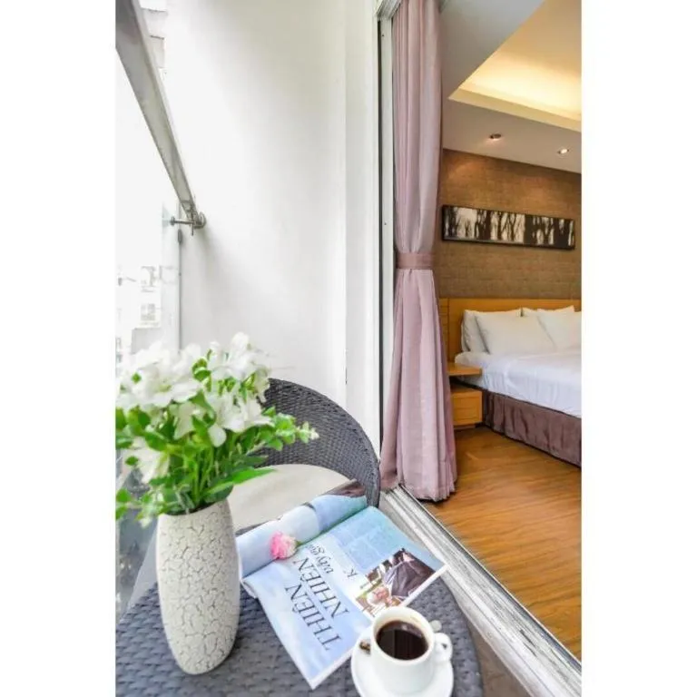 Bed in AHA Boutique Ben Thanh Hotel