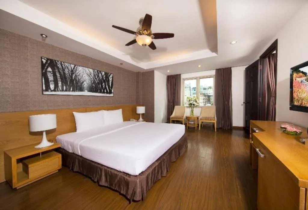 Bed in AHA Boutique Ben Thanh Hotel