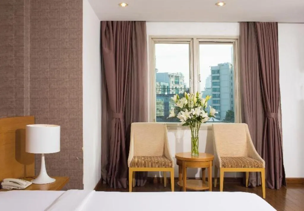 Bed in AHA Boutique Ben Thanh Hotel