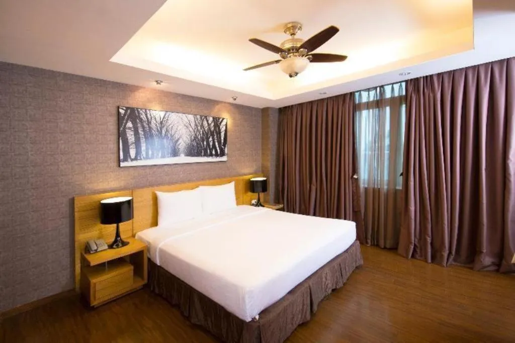 Bed in AHA Boutique Ben Thanh Hotel