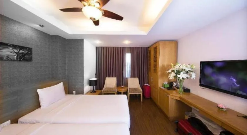 Bed in AHA Boutique Ben Thanh Hotel