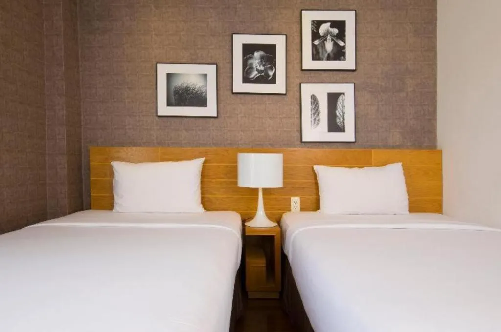 Bed in AHA Boutique Ben Thanh Hotel