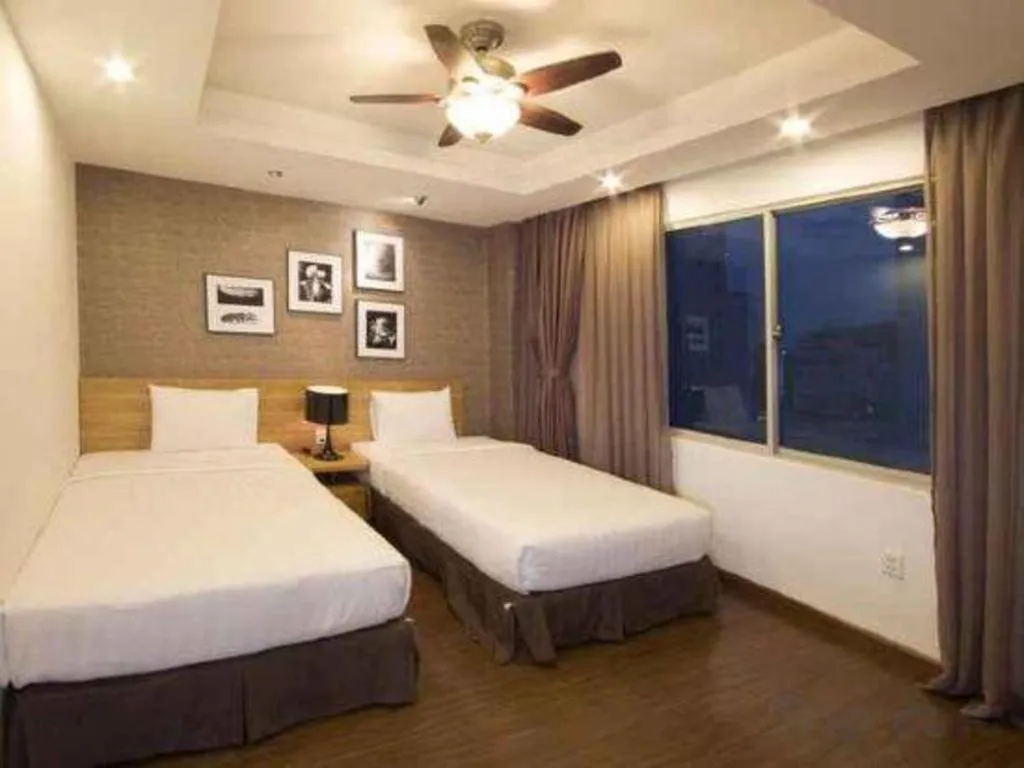 Bed in AHA Boutique Ben Thanh Hotel