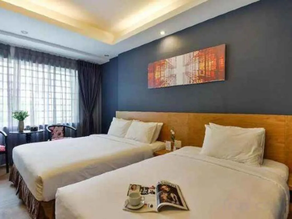 Bed in AHA Boutique Ben Thanh Hotel