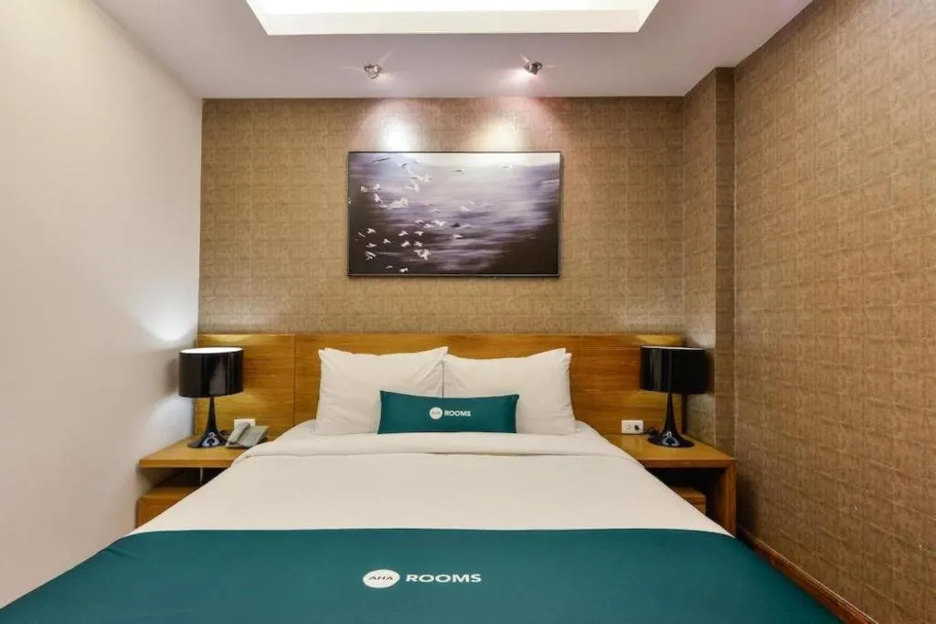 Bed in AHA Boutique Ben Thanh Hotel