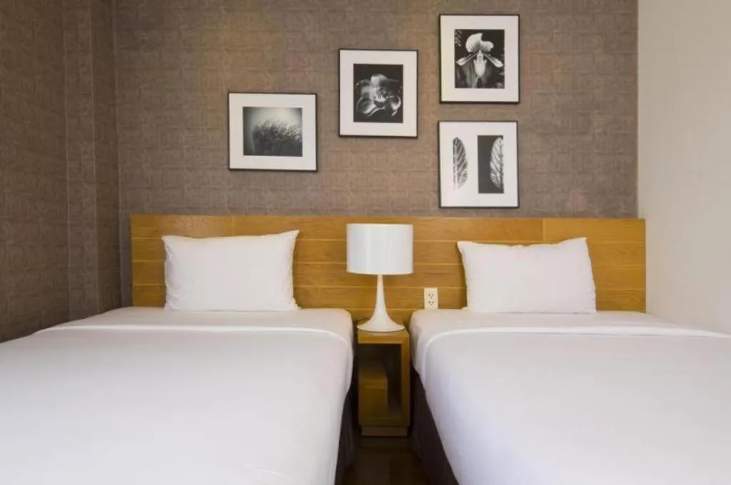 Bed in AHA Boutique Ben Thanh Hotel