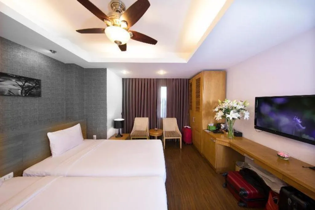 Bed in AHA Boutique Ben Thanh Hotel