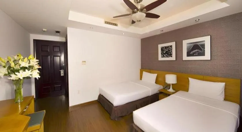 Bed in AHA Boutique Ben Thanh Hotel