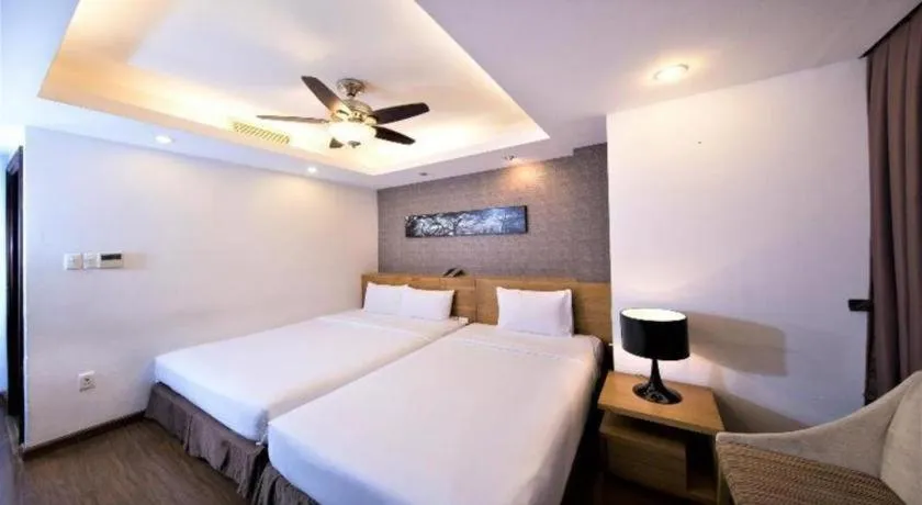 Bed in AHA Boutique Ben Thanh Hotel