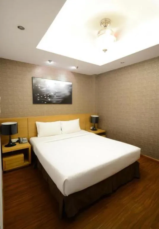 Bed in AHA Boutique Ben Thanh Hotel