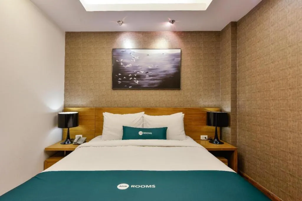 Bed in AHA Boutique Ben Thanh Hotel