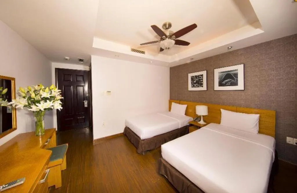 Bed in AHA Boutique Ben Thanh Hotel