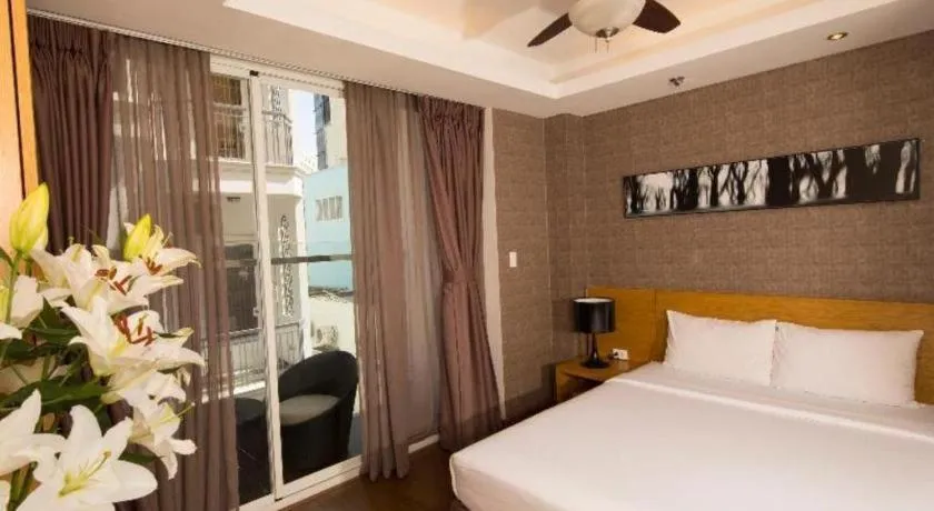 Bed in AHA Boutique Ben Thanh Hotel