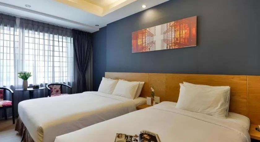 Bed in AHA Boutique Ben Thanh Hotel