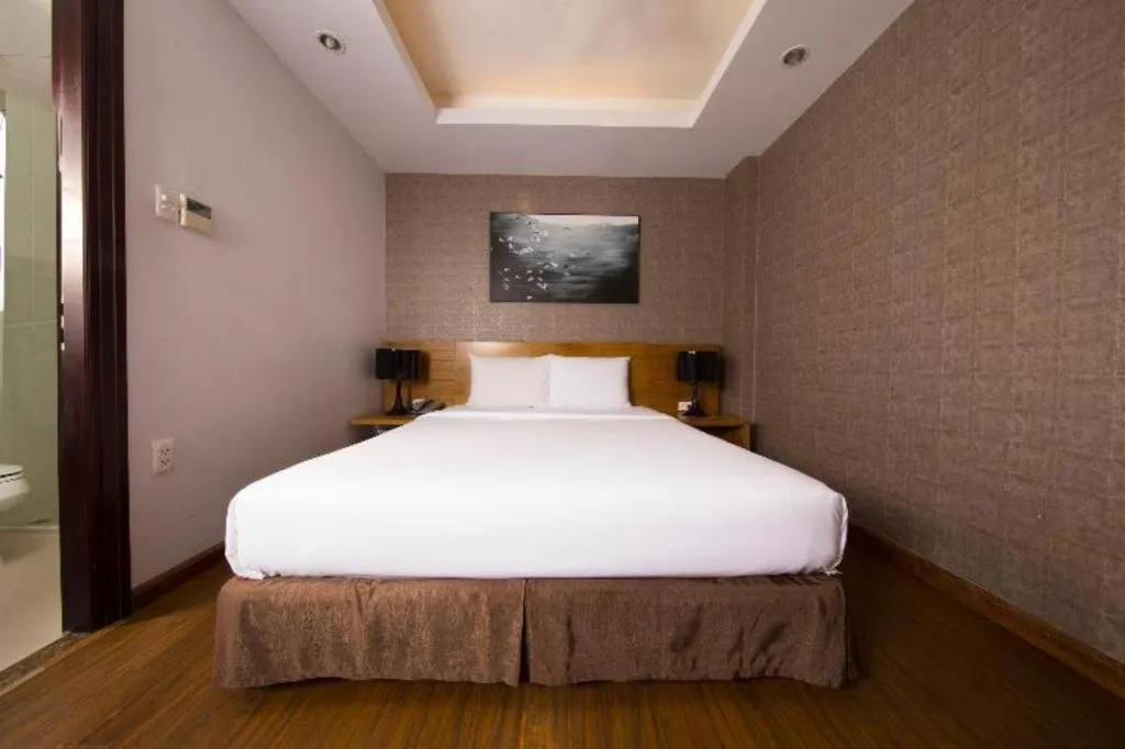 Bed in AHA Boutique Ben Thanh Hotel