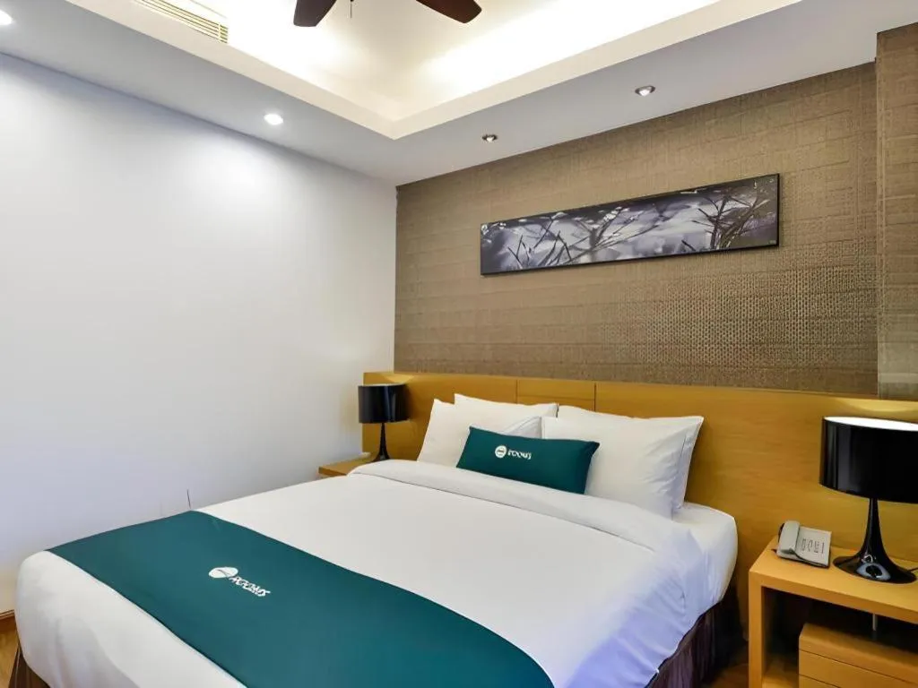 Bed in AHA Boutique Ben Thanh Hotel