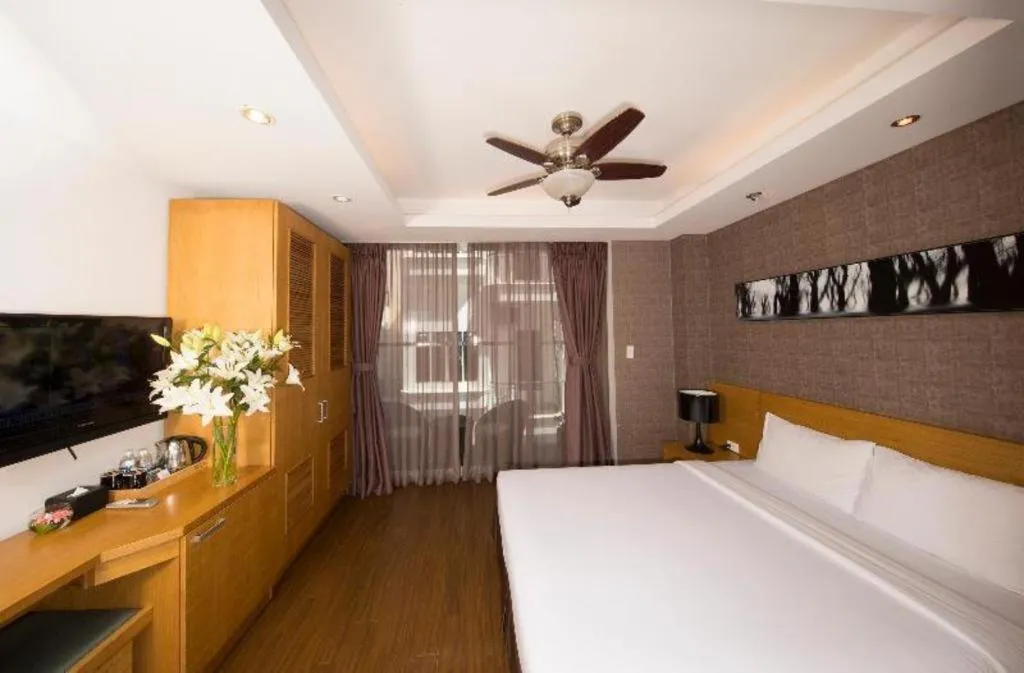 Bed in AHA Boutique Ben Thanh Hotel