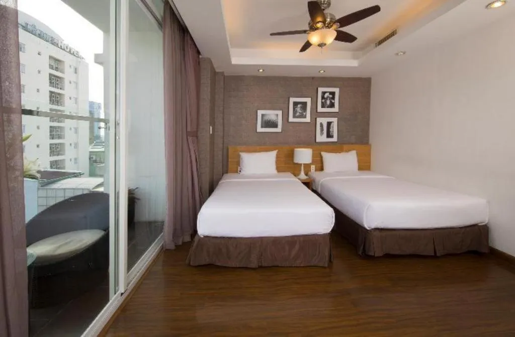 Bed in AHA Boutique Ben Thanh Hotel