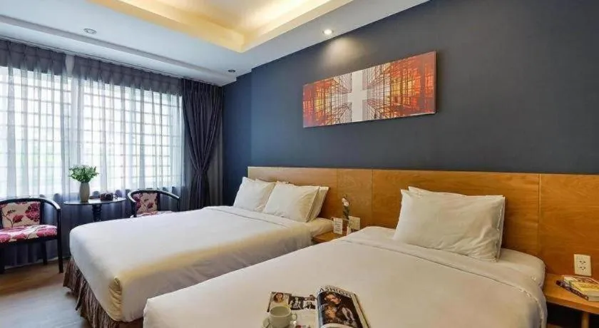 Bed in AHA Boutique Ben Thanh Hotel