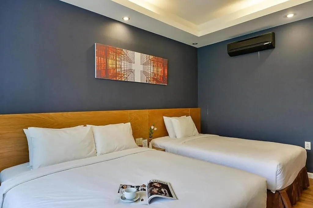Bed in AHA Boutique Ben Thanh Hotel