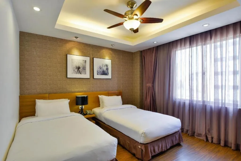 Bed in AHA Boutique Ben Thanh Hotel