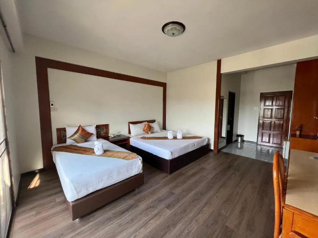 Bed in Chao Phya Grand Hotel