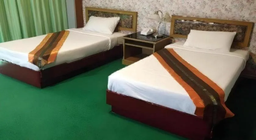 Bed in Chao Phya Grand Hotel