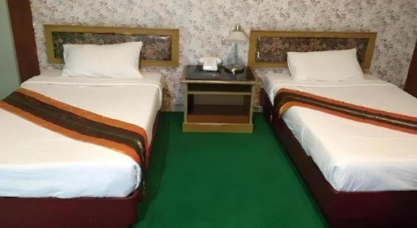 Bed in Chao Phya Grand Hotel