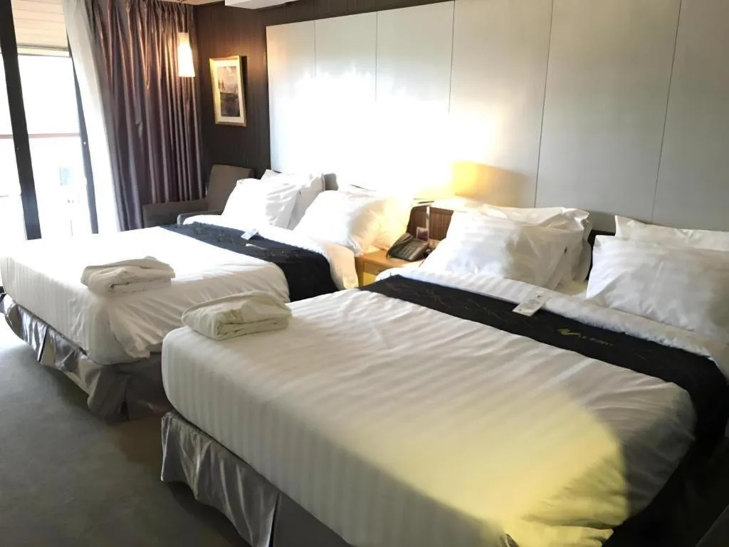 Bed in Le Monet Hotel