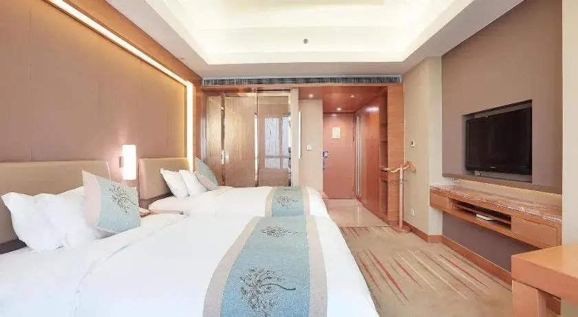 Bed in Howard Johnson by Wyndham Sunshine Plaza Ningbo Bed in Howard Johnson by Wyndham Sunshine Plaza Ningbo