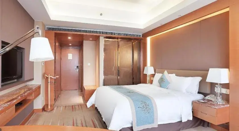 Bed in Howard Johnson by Wyndham Sunshine Plaza Ningbo Bed in Howard Johnson by Wyndham Sunshine Plaza Ningbo