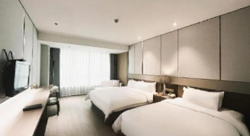 Bed in Howard Johnson by Wyndham Sunshine Plaza Ningbo
