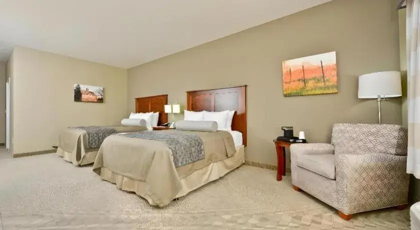 Bed in Green Mill Village Hotel & Suites, BW Signature Collection Bed in Green Mill Village Hotel & Suites, BW Signature Collection