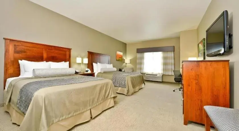 Bed in Green Mill Village Hotel & Suites, BW Signature Collection Bed in Green Mill Village Hotel & Suites, BW Signature Collection