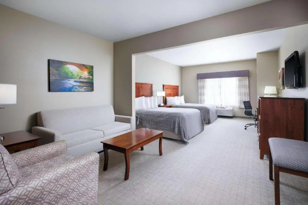 Bed in Green Mill Village Hotel & Suites, BW Signature Collection