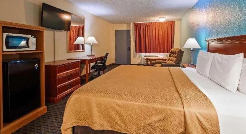 Bed in SureStay Hotel