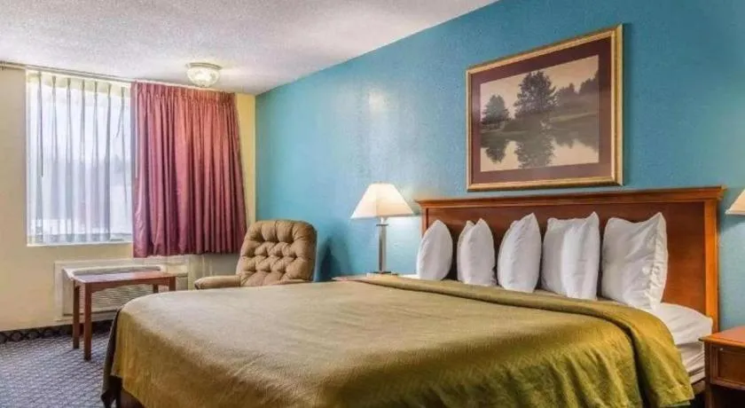 Bed in SureStay Hotel