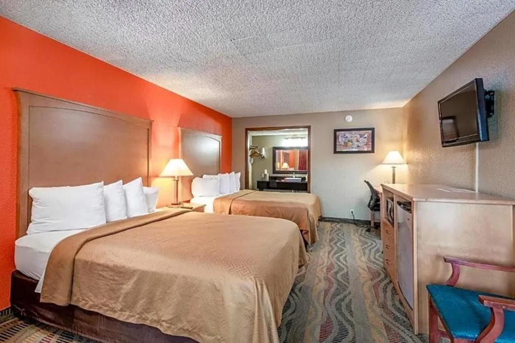 Bed in SureStay Hotel