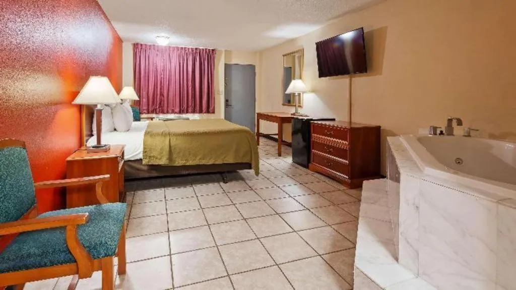 Bed in SureStay Hotel