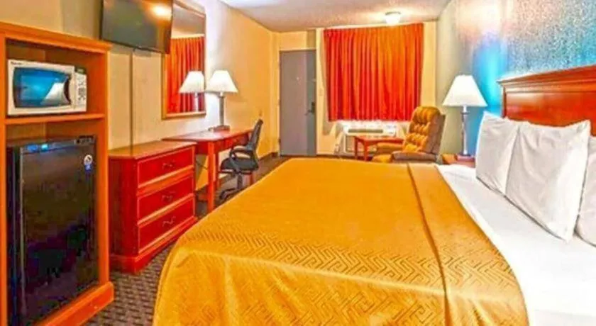 Bed in SureStay Hotel