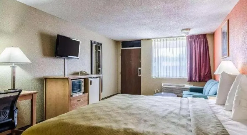 Bed in SureStay Hotel