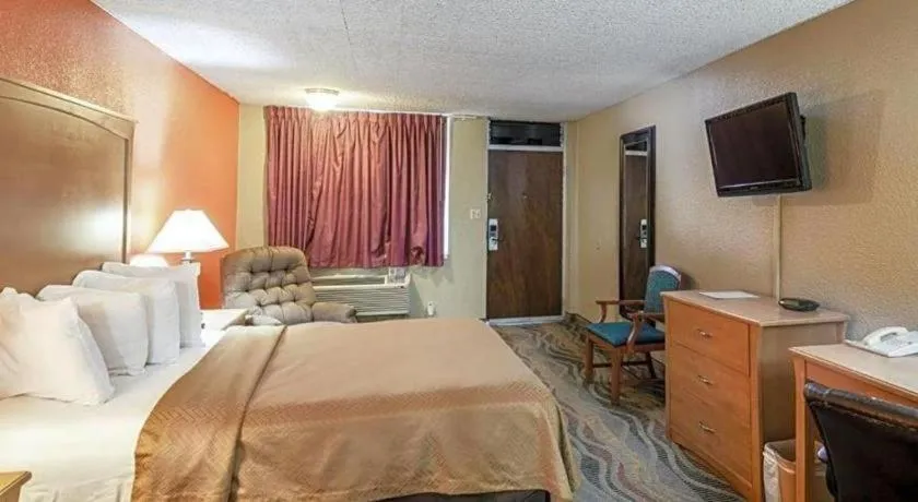 Bed in SureStay Hotel